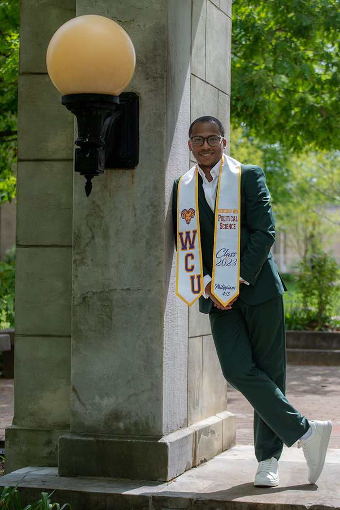 Student standing infront of archway