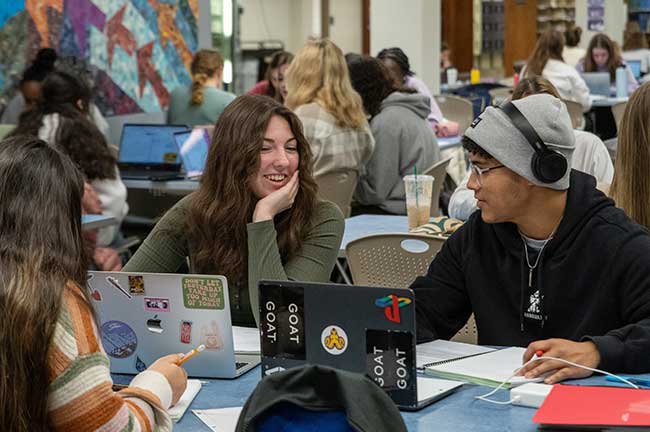 Student at involvement fair table