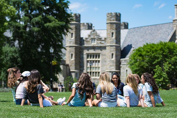 Sorority sisters sitting in a circle in the quad