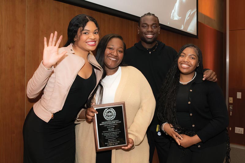 Left to right Journey Washington, student co-host of the MLK Brunch, with ECAY members Mya Hill, Perez Abhuilmen, and Kyanna Randolph (president).