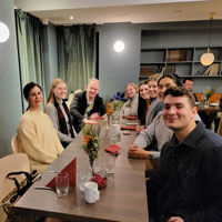 group smiling at table