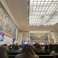 Inside musuem showing a promotional screen for IRAN