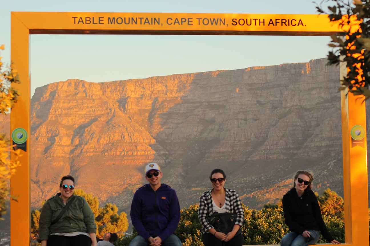 Group sitting in a square