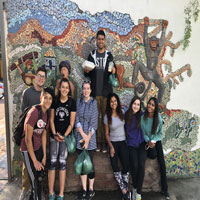 Group in front of a mosaic