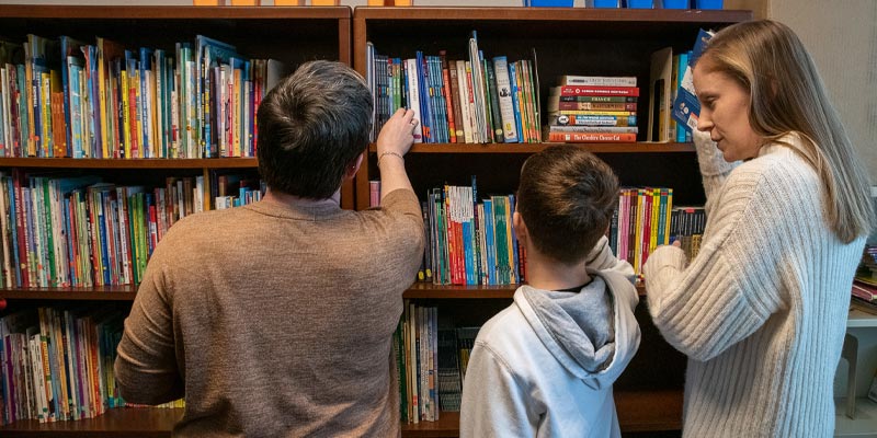 Student Teacher in a library with students