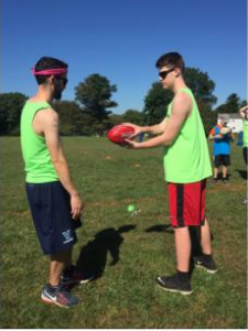 2 people playing football