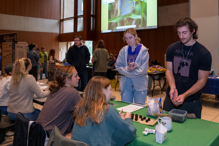 Event participants make Seed Balls at the Food Recovery Network's exhibit