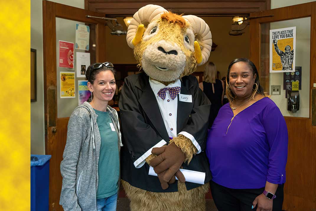 Rammy in a tuxedo with WCU employees