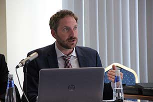 Anthropologist Dr. Michael A. Di Giovine at podium