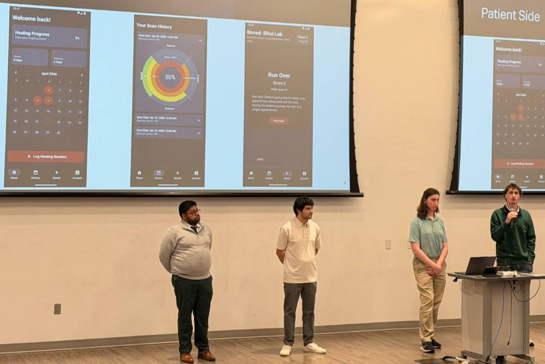 Orthoforge Capstone presentation Students presenting on stage