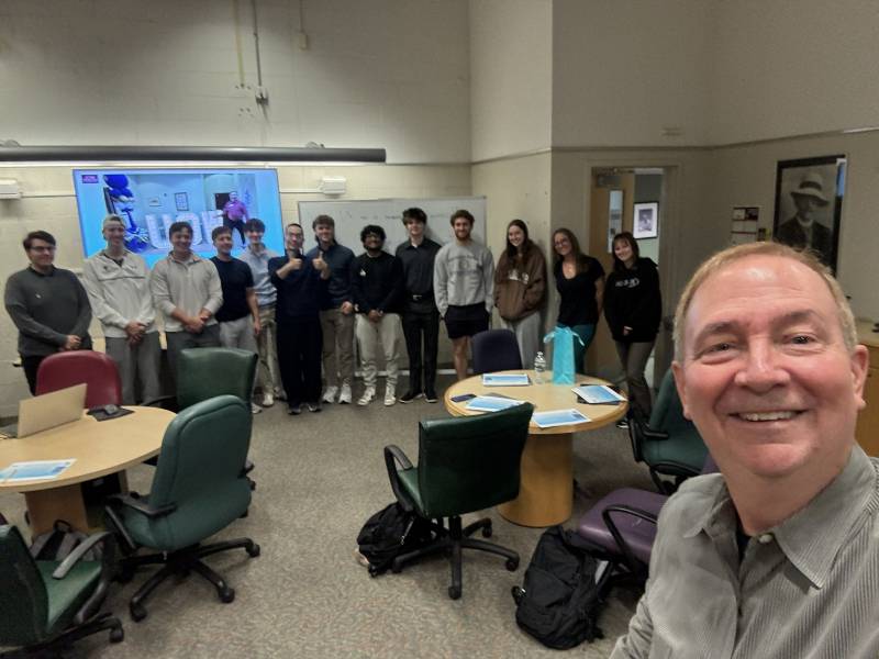 John Buchanan selfie with students in the background